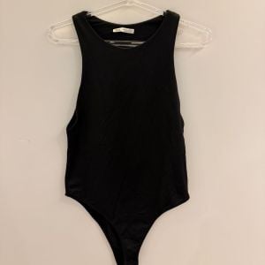 body zara preto m 144107072?action_source=75772&ref=home_home&rsp=1&rspix=1