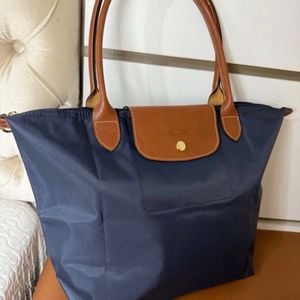 bolsa longchamp le pliage m azul marinho 144917584?action_source=67222&ref=home_home&rsp=1&rspix=1