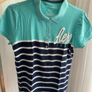 camiseta feminina 129819859?action_source=70688&ref=home_home&rsp=1&rspix=1