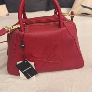 bolsa lanca perfume vermelha 148898609?action_source=72470&ref=home_home&rsp=1&rspix=1