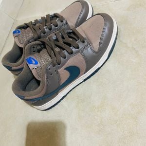 tenis nike dunk low mink brown infantil 150510996?action_source=76398&ref=home_home&rsp=1&rspix=1