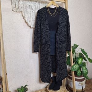 cardigan alongado feminino estampado m 144815413?action_source=31319&ref=home_home&rsp=1&rspix=1
