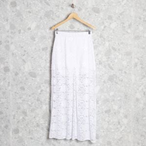 saia longa off white rendada toli 110755211?action_source=70358&ref=home_home&rsp=1&rspix=1