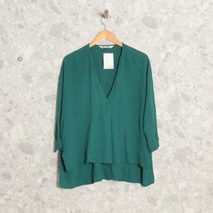 blusa verde zara 139256360?action_source=70754&ref=home_home&rsp=1&rspix=1