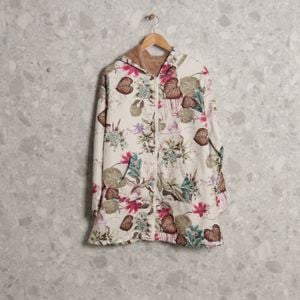 casaco branco floral 138917117?action_source=70754&ref=home_home&rsp=1&rspix=1