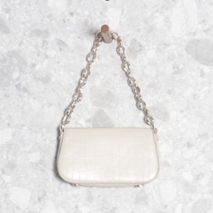 bolsa caqui zara 129884063?action_source=70853&ref=home_home&rsp=1&rspix=1