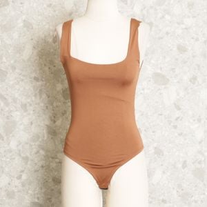 body marrom 133389334?action_source=66728&ref=home_home&rsp=1&rspix=1