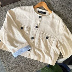 blusa cropped zara linho creme gg 146060007?action_source=72767&ref=home_home&rsp=1&rspix=1