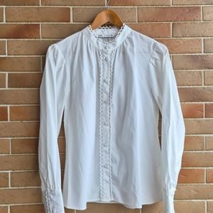 zara camisa com detalhe 150485485?action_source=76396&ref=home_home&rsp=1&rspix=1