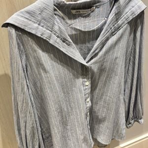 camisa zara listrada azul pp 145309859?action_source=76396&ref=home_home&rsp=1&rspix=1