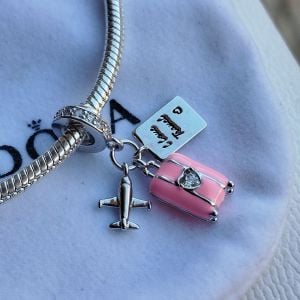 charm pandora mala rosa aviao 144890151?action_source=67326&ref=home_home&rsp=1&rspix=1