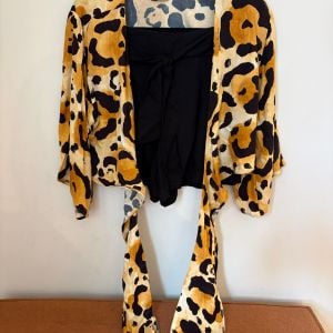 conjunto agua de coco shorts e blusa estampado 150347772?action_source=76858&ref=home_home&rsp=1&rspix=1