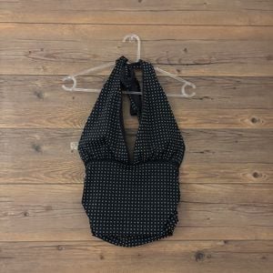 top zara frente unica preto brilhoso 147693105?action_source=77221&ref=home_home&rsp=1&rspix=1