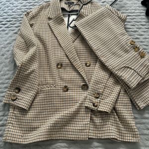 conjunto xadrez blazer e calça zara