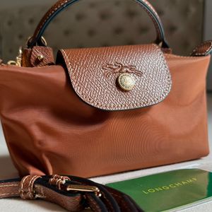 longchamp le pliage mini crossbody acompanha alca 144702392?action_source=67222&ref=home_home&rsp=1&rspix=1