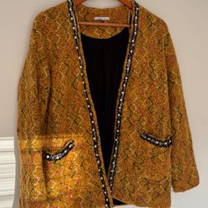 casaco zara tweed mostarda 143823628?action_source=77124&ref=home_home&rsp=1&rspix=1
