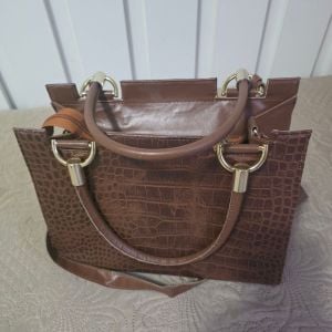 bolsa arezzo tote marrom 148364954?action_source=72767&ref=home_home&rsp=1&rspix=1