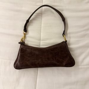 bolsa de ombro marrom vintage zara 152144848?action_source=77124&ref=home_home&rsp=1&rspix=1