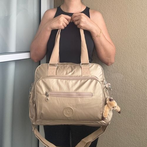 bolsa kipling de ombro e transversal dourada metalica 144593180?action_source=64648&ref=home_home&rsp=1&rspix=1