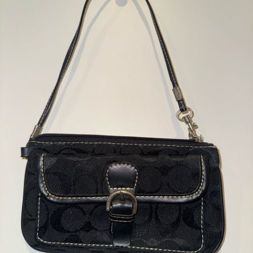 bolsa coach preta 138878766?action_source=76495&ref=home_home&rsp=1&rspix=1