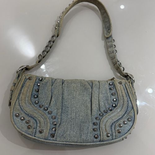 bolsa jeans zara tachas prata 153165769?action_source=77124&ref=home_home&rsp=1&rspix=1