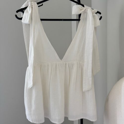blusa zara lacos branca pp 152855650?action_source=76396&ref=home_home&rsp=1&rspix=1