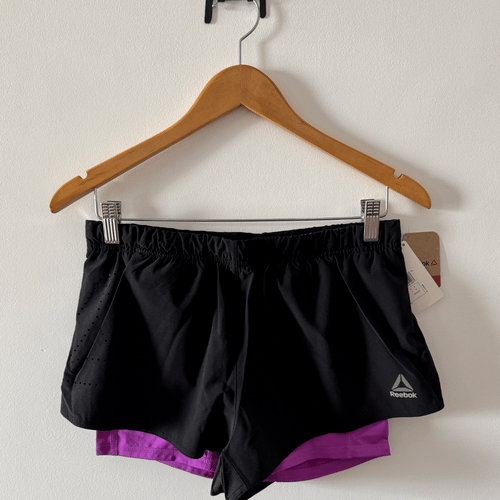 shorts reebok 2 in 1 re compressao interna feminino preto corrida treino academia crossfit m 140267312?action_source=75018&ref=home_home&rsp=1&rspix=1