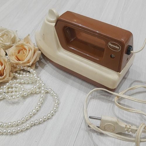 ferro a vapor portatil vintage 77071288?action_source=68872&ref=home_home&rsp=1&rspix=1