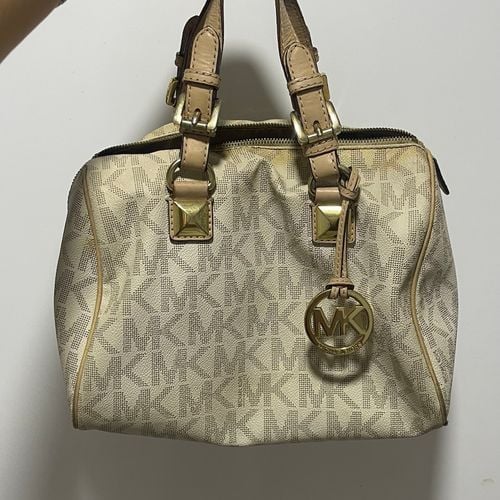 bolsa michael kors monograma bege 144299057?action_source=64648&ref=home_home&rsp=1&rspix=1