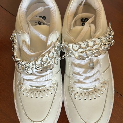 tenis schutz branco couro e metal 133229964?action_source=66827&ref=home_home&rsp=1&rspix=1