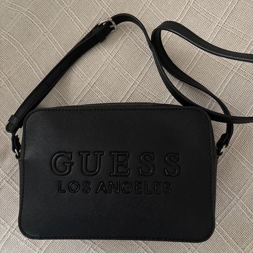 bolsa guess preta transversal 149763605?action_source=77090&ref=home_home&rsp=1&rspix=1