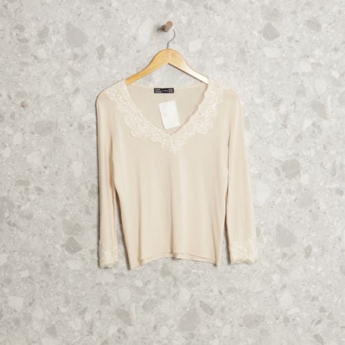 blusa amarela zara 125880242?action_source=70853&ref=home_home&rsp=1&rspix=1