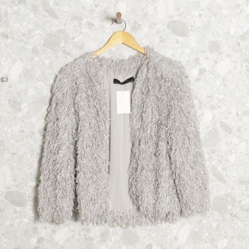 casaquinho cinza pelucia zara 142717858?action_source=71612&ref=home_home&rsp=1&rspix=1