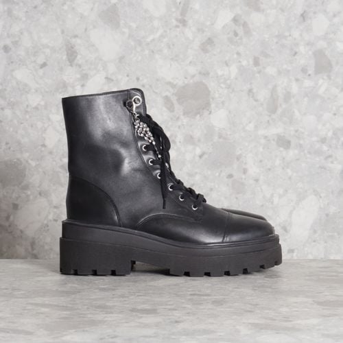 coturno preto schutz 137989065?action_source=70096&ref=home_home&rsp=1&rspix=1