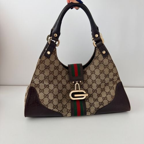 bolsa de ombro gucci gg canvas junco 145549231?action_source=72470&ref=home_home&rsp=1&rspix=1
