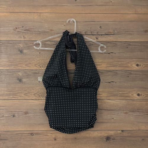 top zara frente unica preto brilhoso 147693105?action_source=77221&ref=home_home&rsp=1&rspix=1