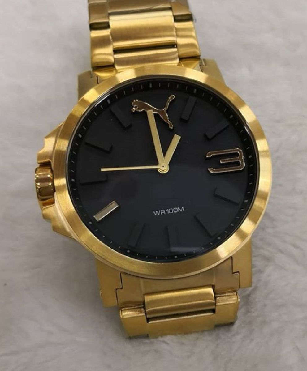 relogio puma dourado