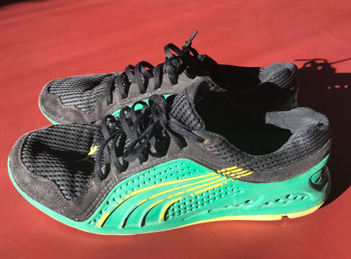 tenis puma preto e amarelo