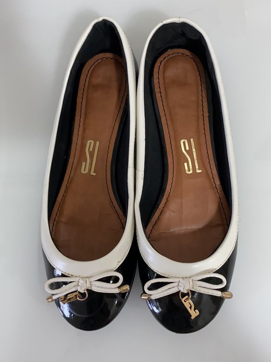 sapatilha preta e branca santa lolla