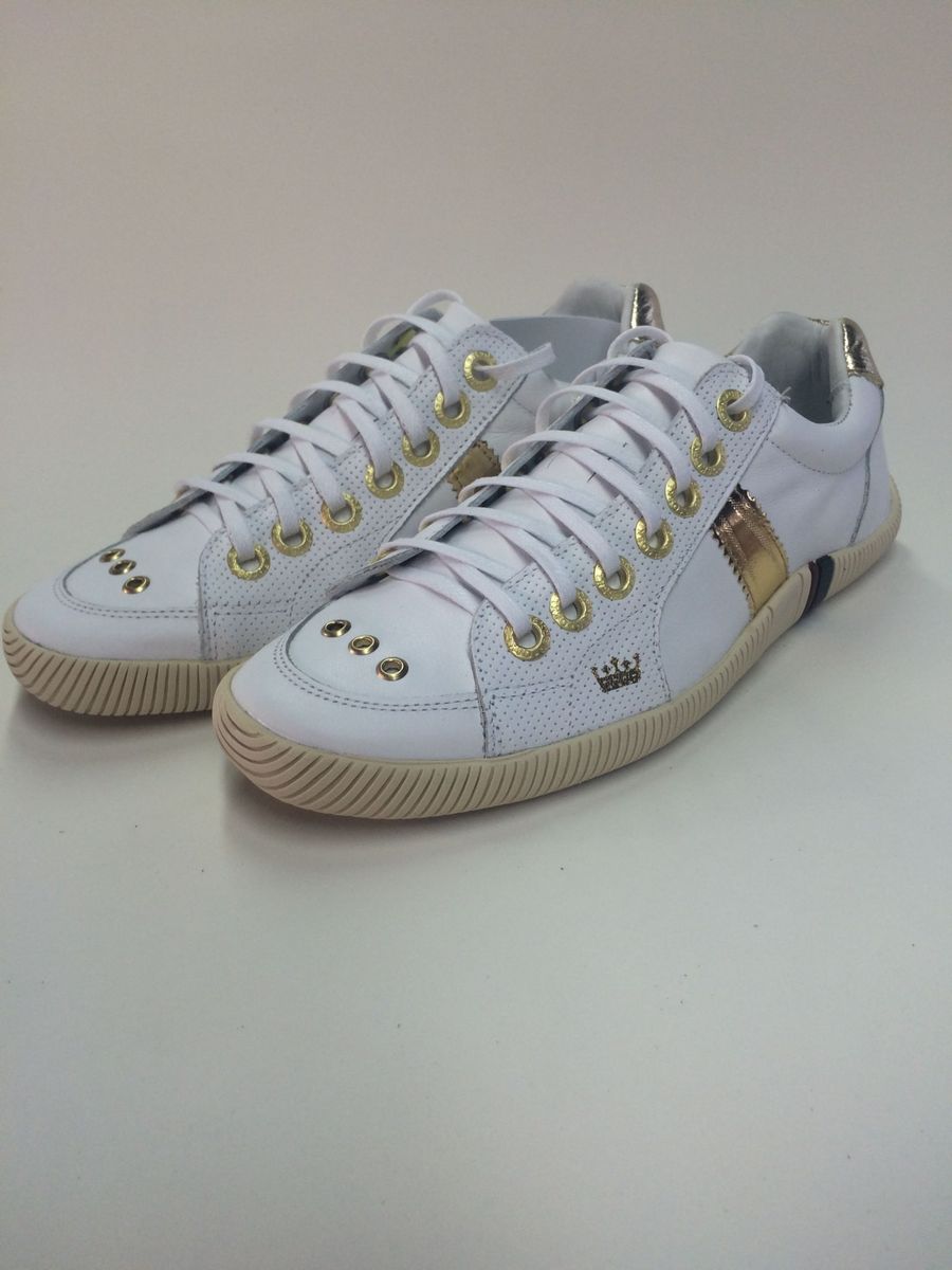 tenis osklen feminino dourado