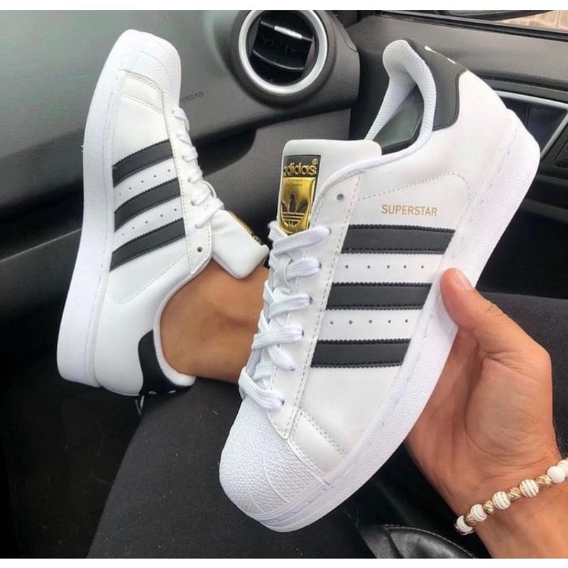 Tenis adidas branco com listras store pretas masculino