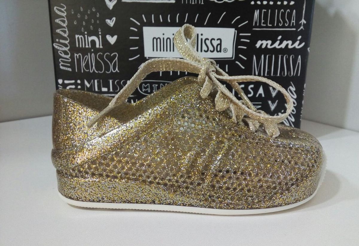 tenis dourado melissa