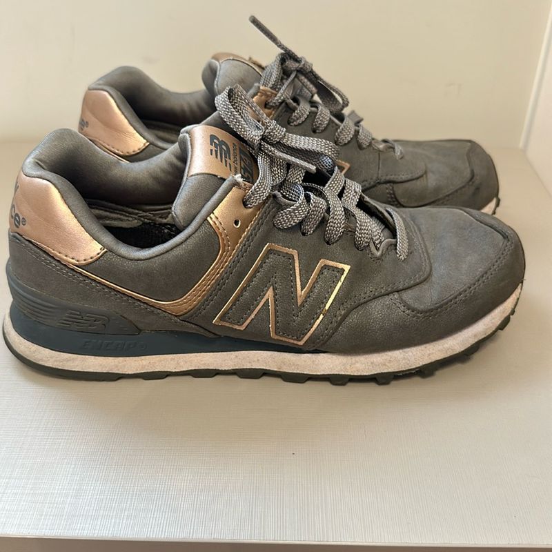 New balance hot sale cinza e dourado