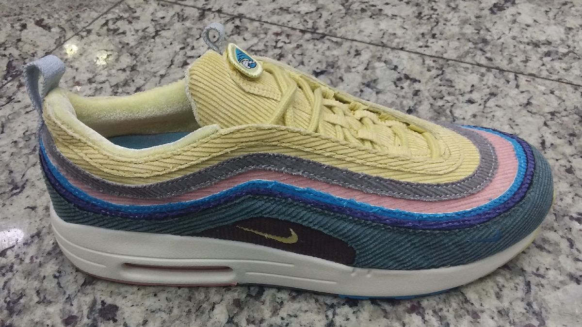 tenis nike azul e amarelo