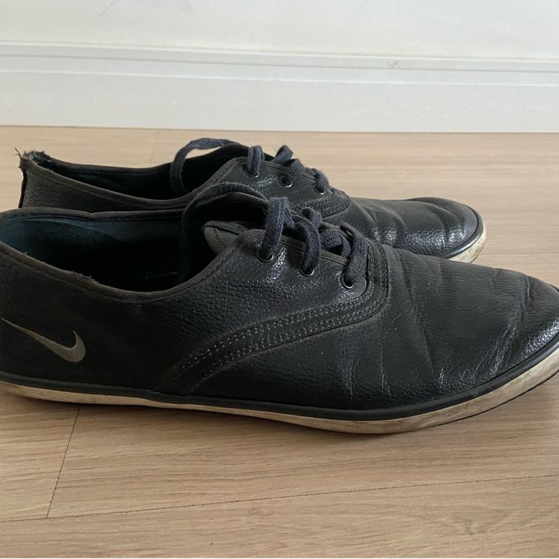 Tenis nike hot sale couro preto