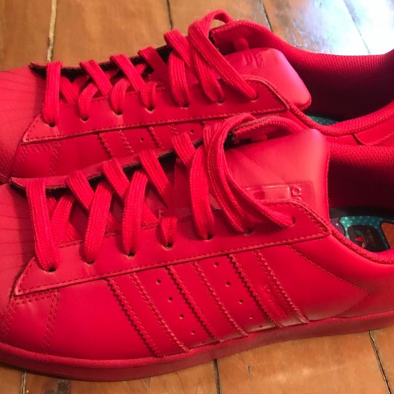 Tenis adidas pharrell williams hot sale vermelho