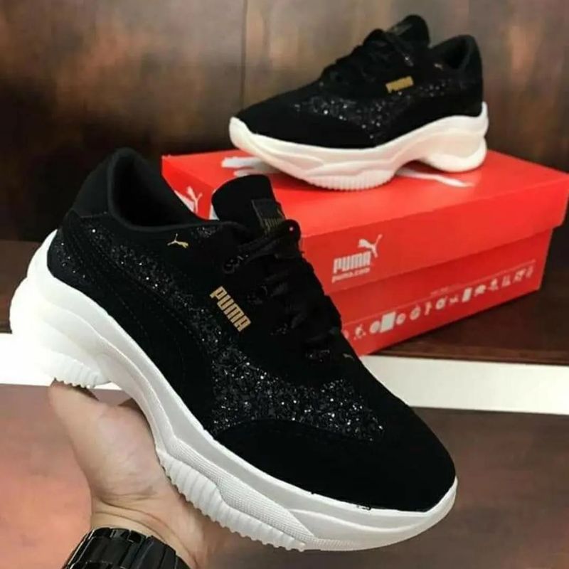 Tenis preto com dourado hot sale feminino