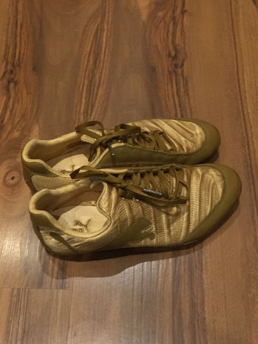 tenis puma dourado feminino