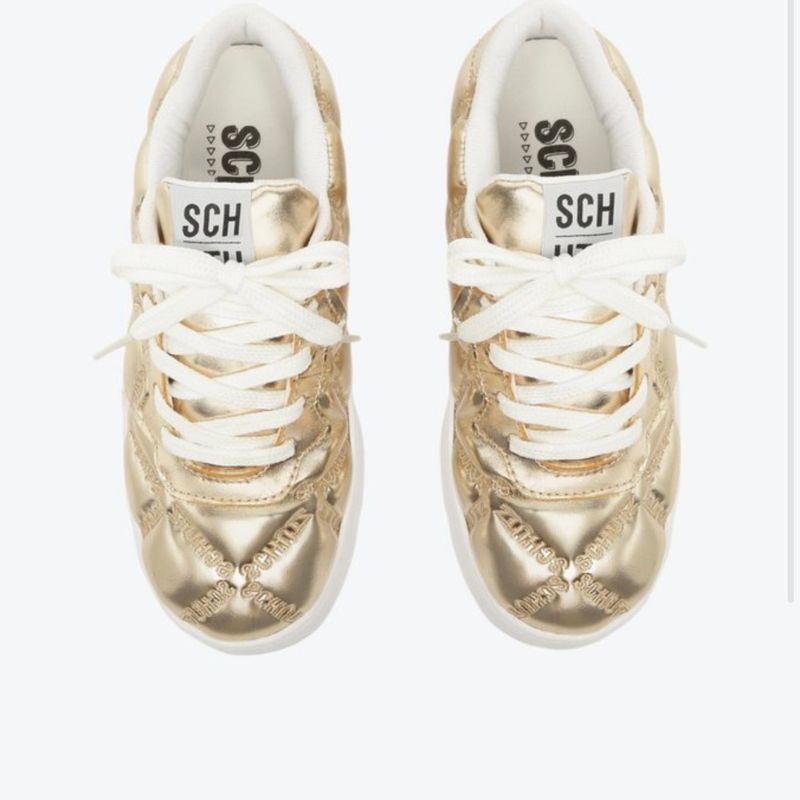 Tenis best sale dourado schutz