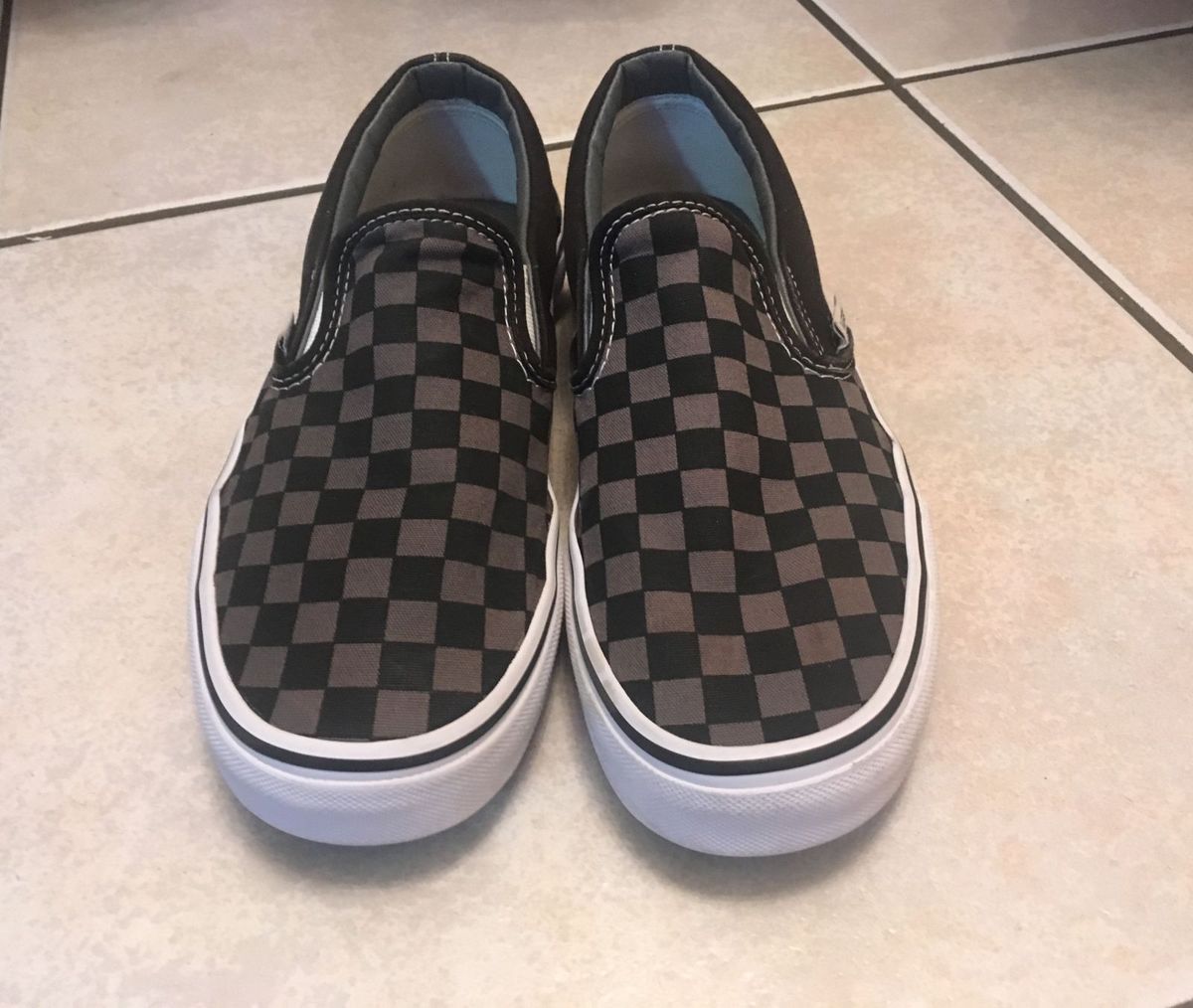 vans slip on quadriculado preto e branco